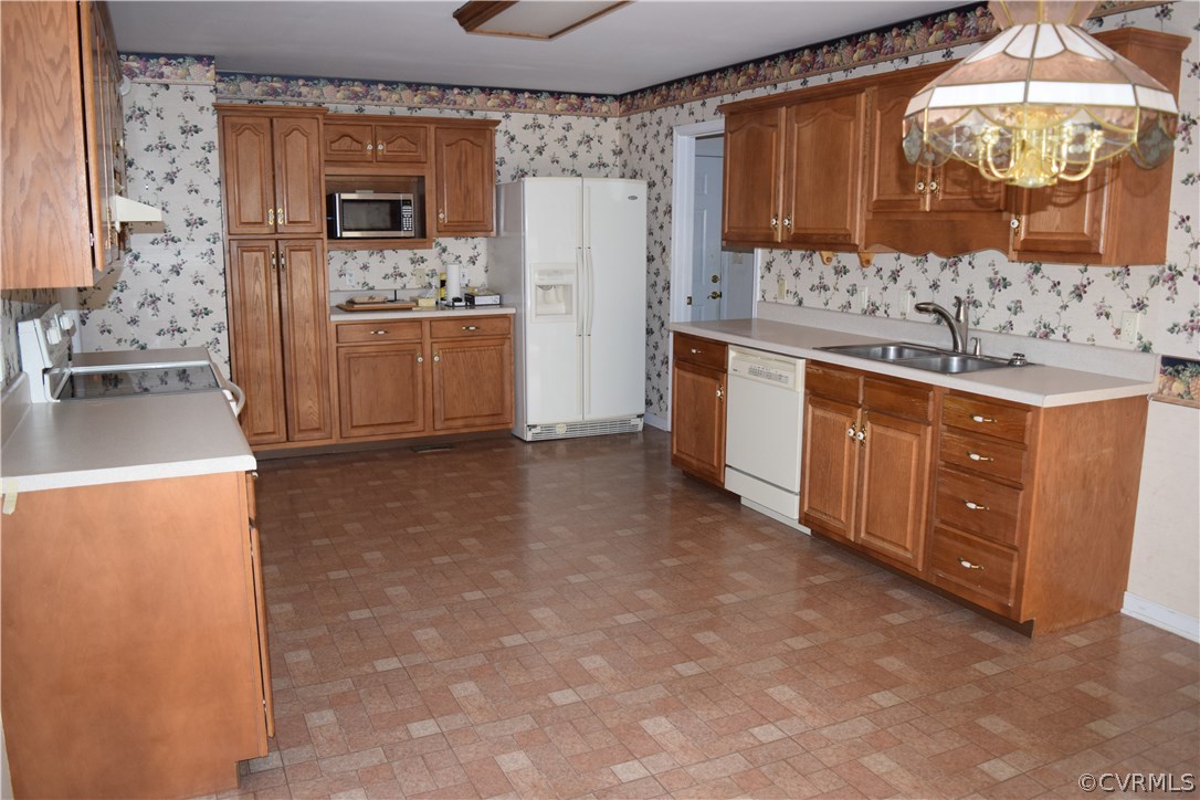 6919 Fieldwood Road Chester, VA 23831 - Photo 8 of 27 a kitchen with stainless steel appliances a refrigerator and a stove