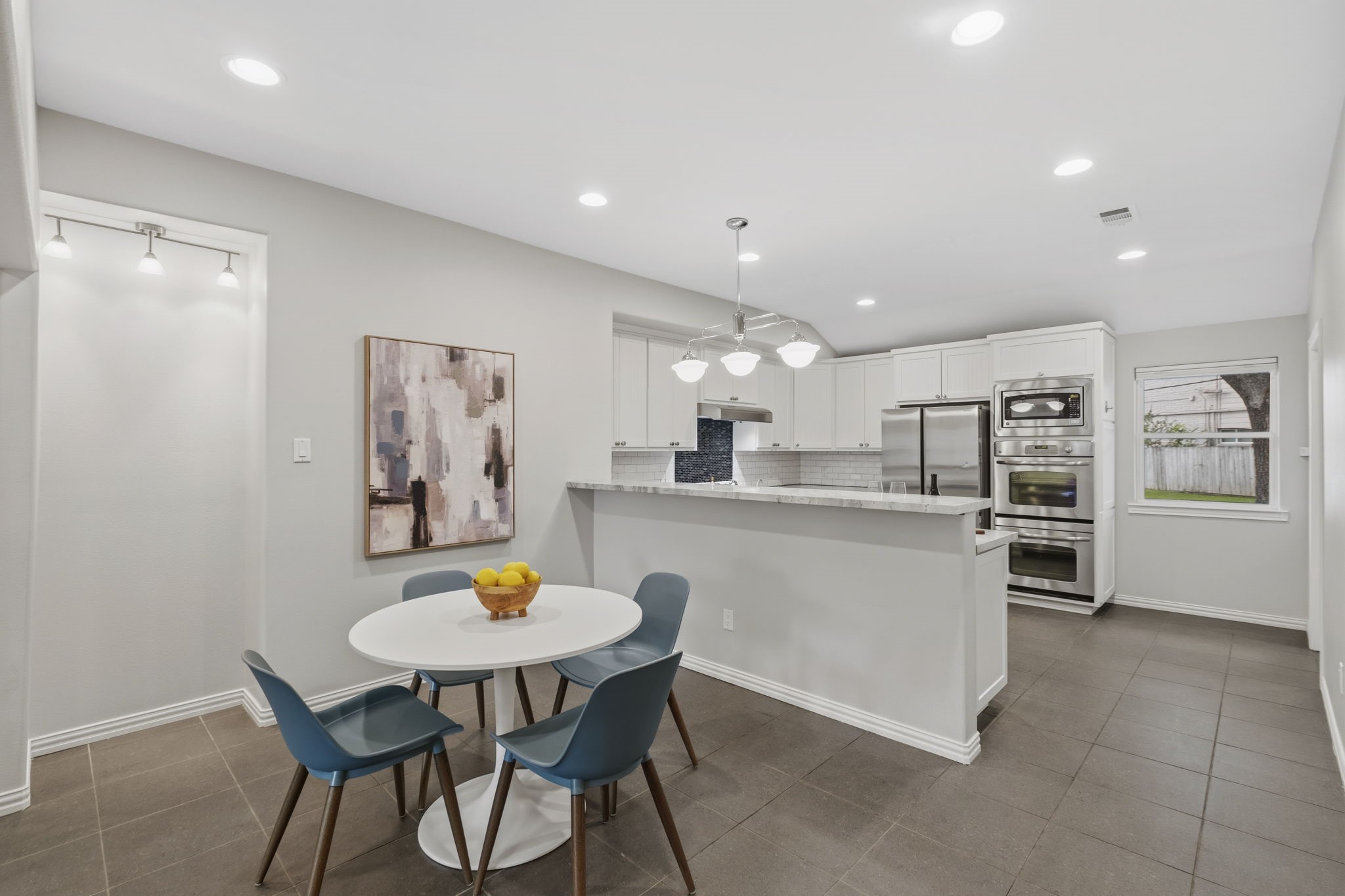 4733 Carleen Road Houston, TX 77092 - Photo 7 of 22 Positioned just off the kitchen, the dining area offers an easy flow for casual meals and hosting guests.