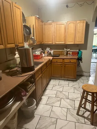 a kitchen with a sink appliances and cabinets