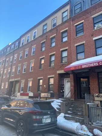 a front view of a building with street view