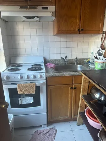 a kitchen with a stove and cabinets