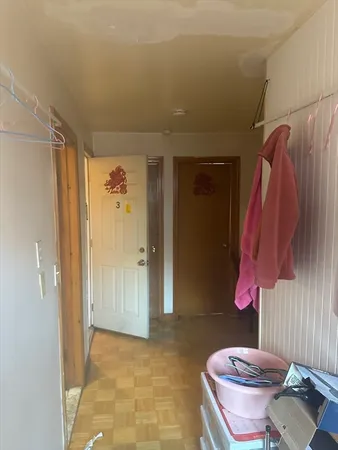 a bathroom with a shower curtain and a sink