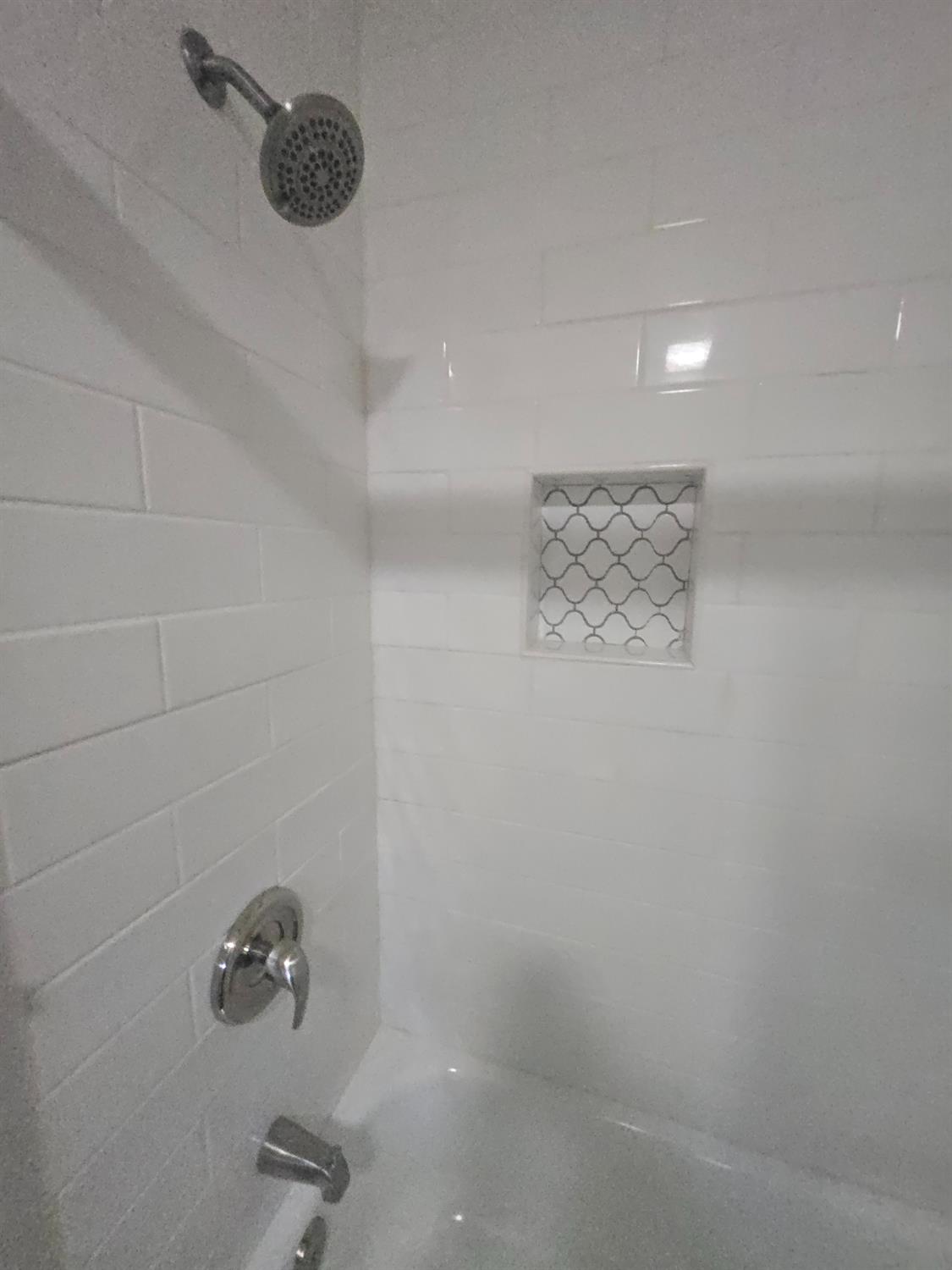 10601 Lime Kiln Road Grass Valley, CA 95949 - Photo 31 of 79 Tub/shower combo featuring glass doors and tile.