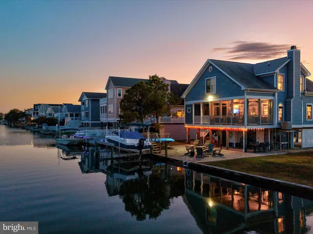 an aerial view of a house with a ocean view