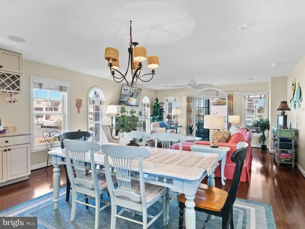 a dining room with furniture and wooden floor