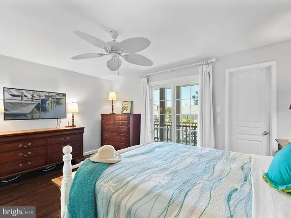 a bathroom with a double vanity sink toilet and a mirror