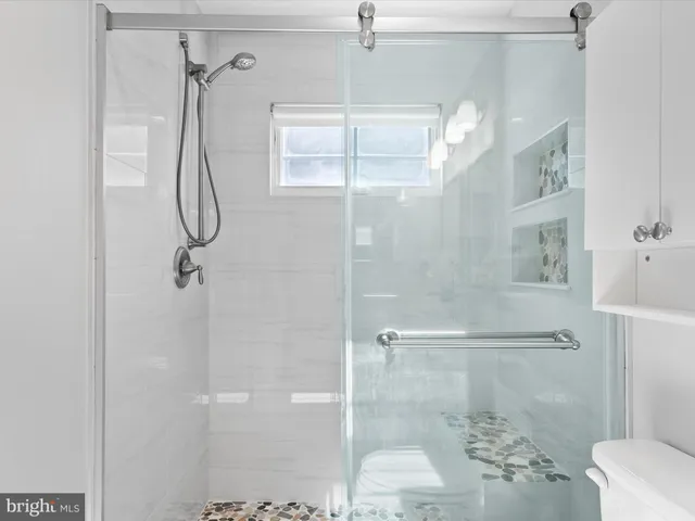 a bedroom with a bed and a table in it