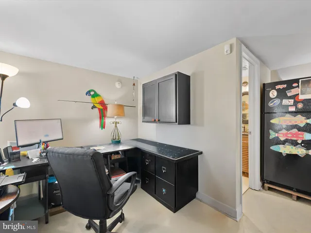 an aerial view of residential houses with city view