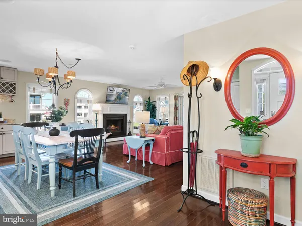 a living room with furniture fireplace and window