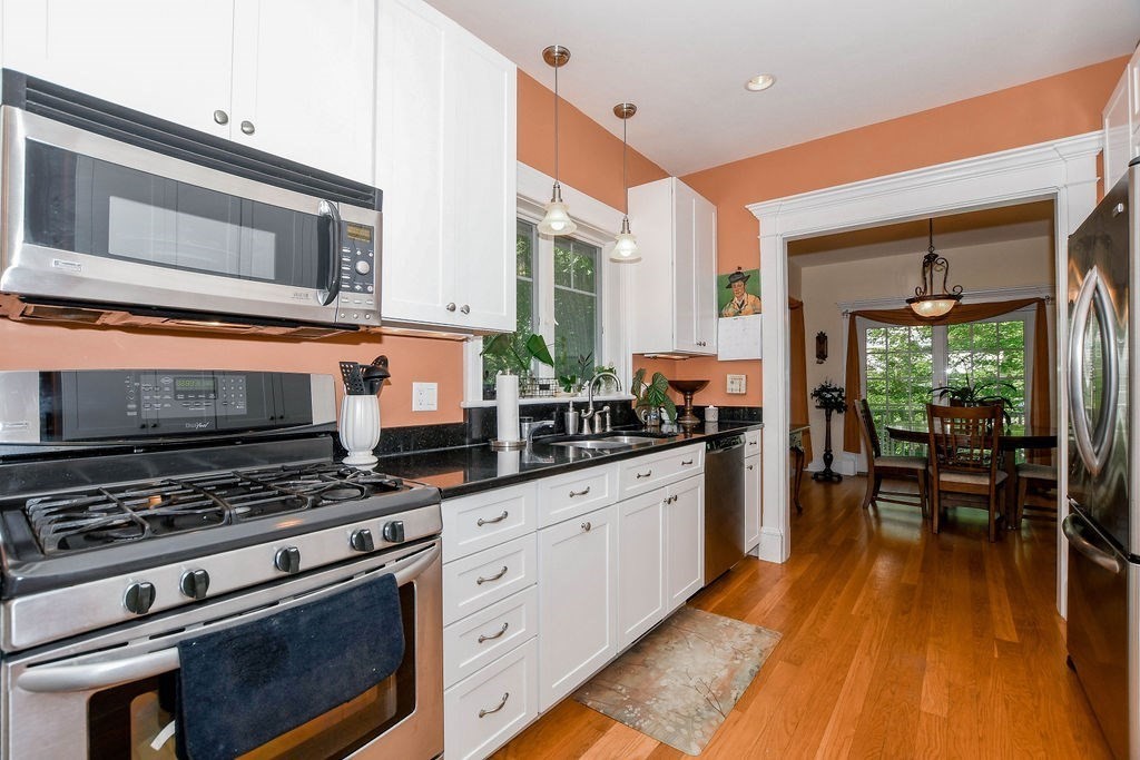 6 Jobs Cove Road Marion, MA 02738 - Photo 12 of 34 a kitchen with stainless steel appliances a stove a sink and cabinets