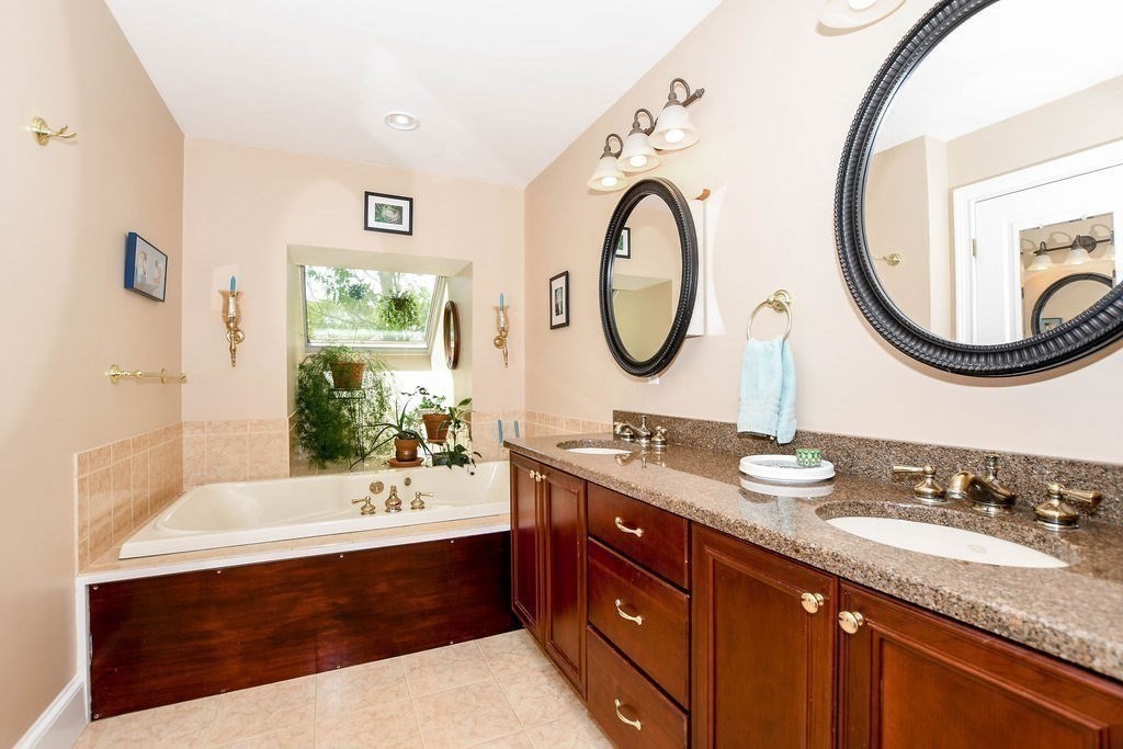 6 Jobs Cove Road Marion, MA 02738 - Photo 19 of 34 a bathroom with a granite countertop sink and a mirror