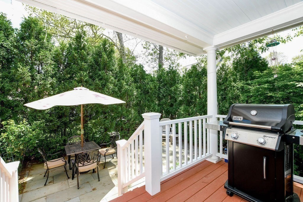 6 Jobs Cove Road Marion, MA 02738 - Photo 28 of 34 a view of a patio with a table chairs and a wooden deck