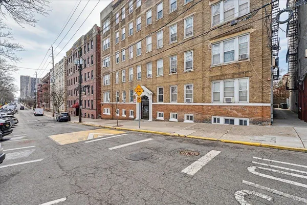 a front view of a building with street view
