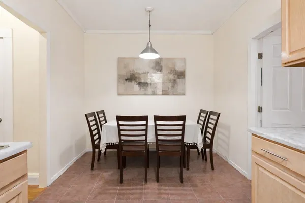 a dining room with furniture and window