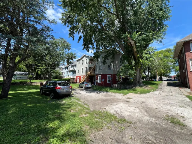a kitchen with granite countertop a refrigerator and a stove