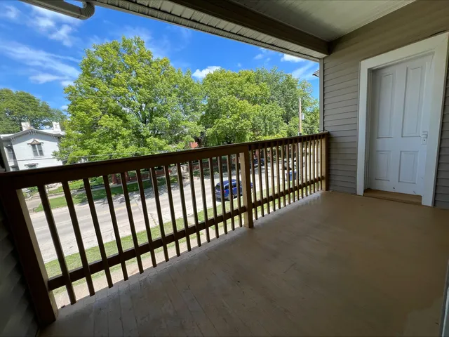 a bathroom with a sink toilet and window