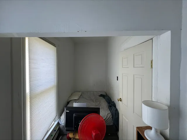 a view of an empty room with a window