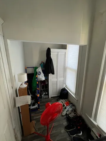 a kitchen with a stove sink and cabinets