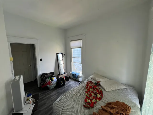 a front view of house with yard and trees