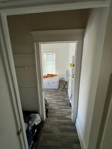 a front view of a house with a garden and yard