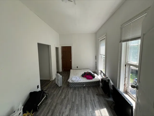a view of a livingroom with furniture and staircase