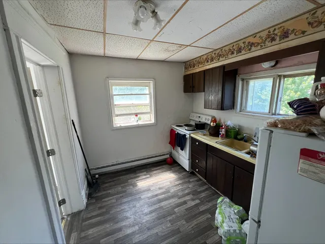 a kitchen with a sink and refrigerator