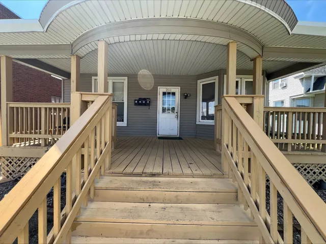 a view of a patio with a table and chairs