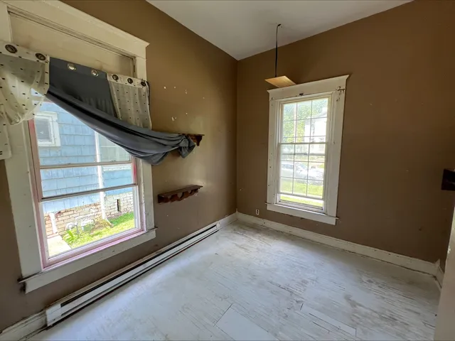 a backyard of a house with outdoor seating