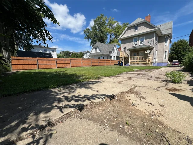 a kitchen with stainless steel appliances granite countertop a stove a microwave and a refrigerator