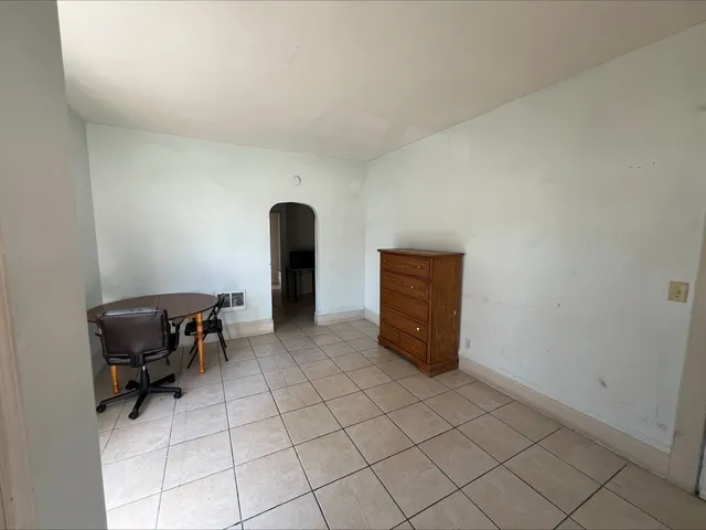 a kitchen with a refrigerator and a stove