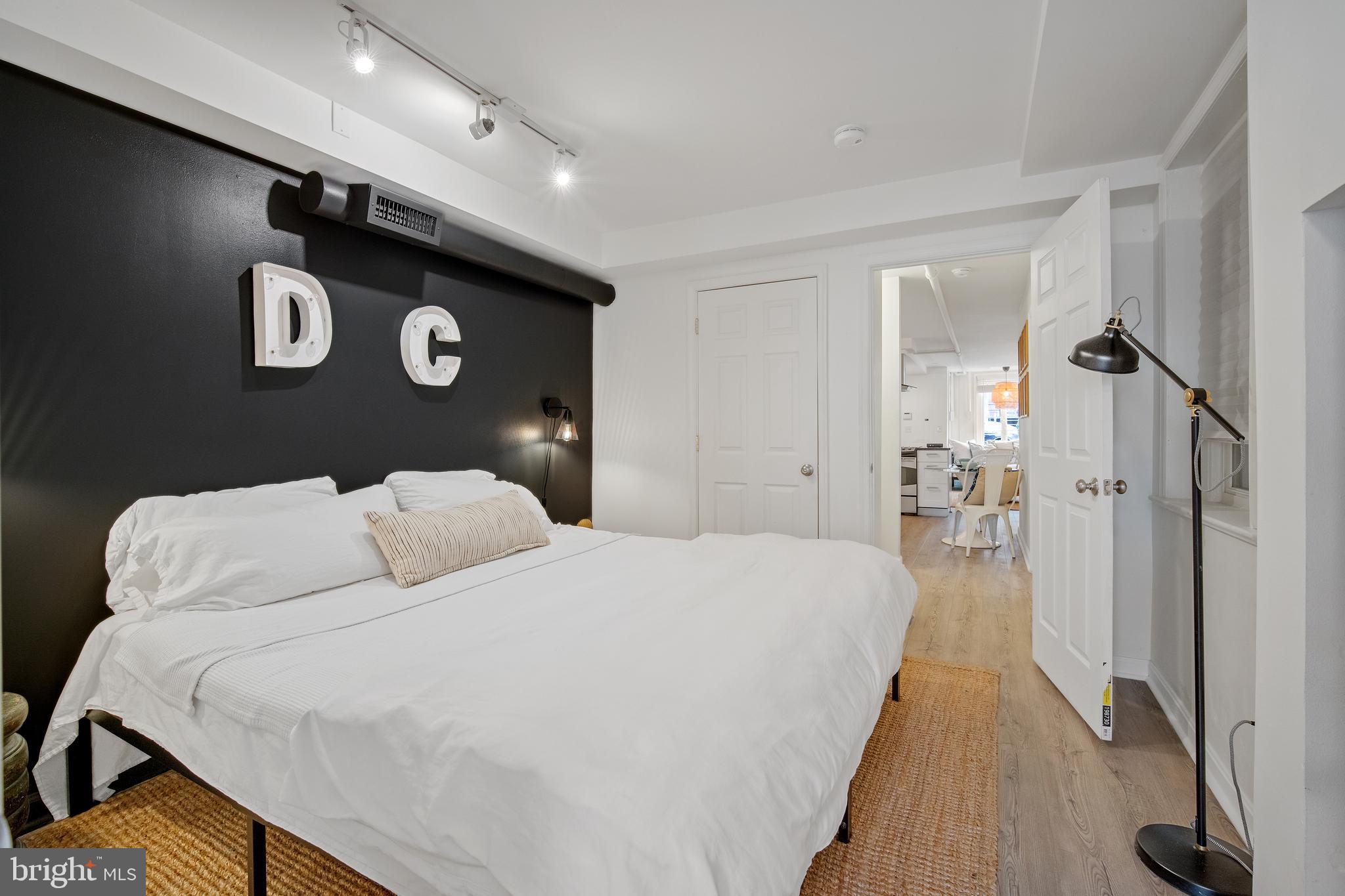 39 S Street Northwest Washington, DC 20001 - Photo 47 of 54 Lower Unit Bedroom w King Bed and Sconces