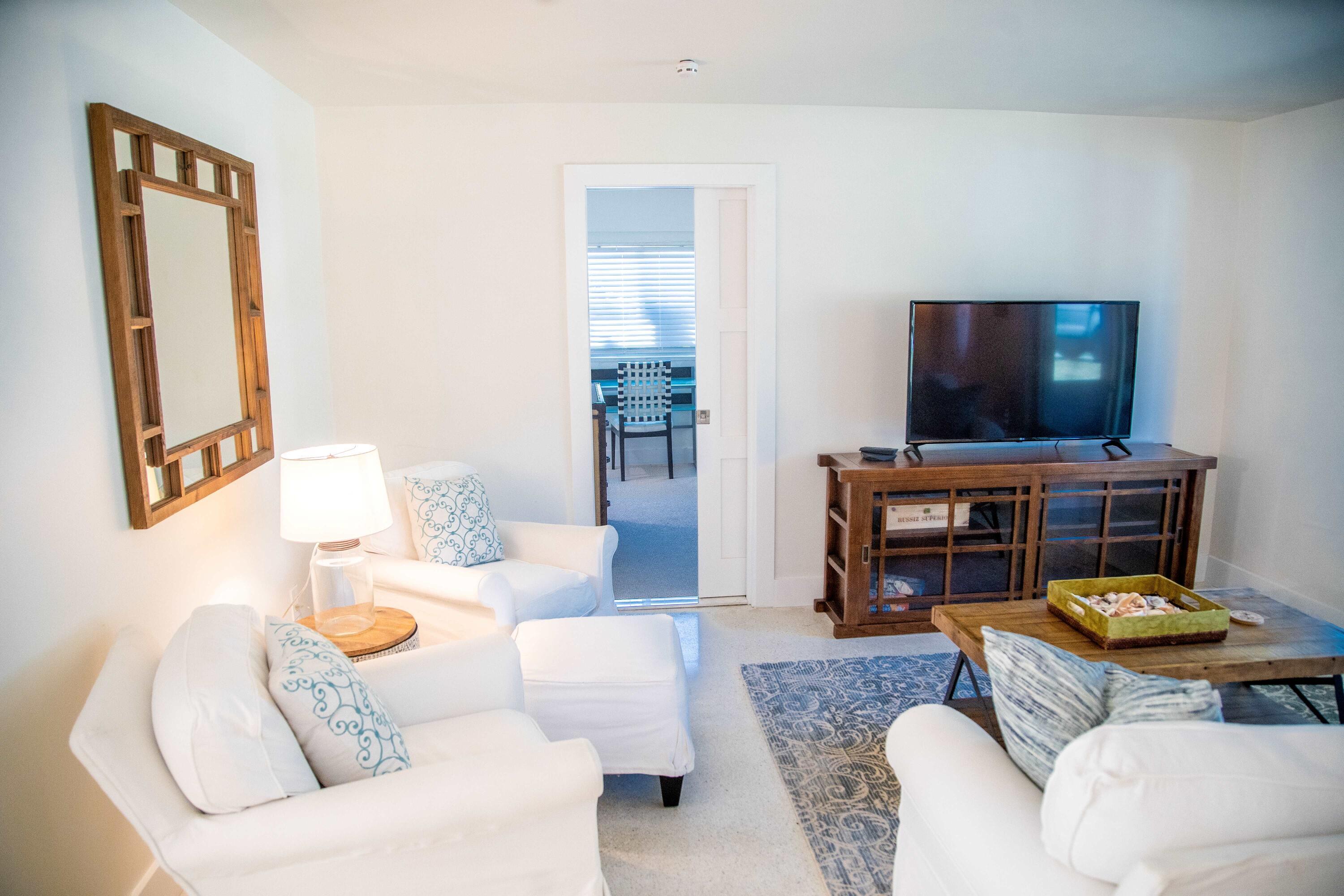 22 Van Road Jupiter, FL 33469 - Photo 12 of 38 a living room with furniture and a flat screen tv