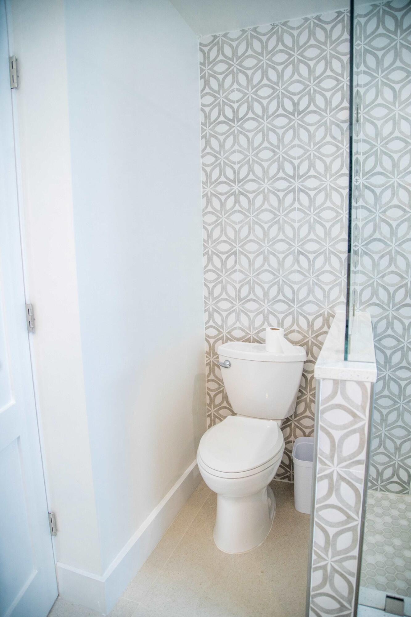 22 Van Road Jupiter, FL 33469 - Photo 17 of 38 a white toilet sitting next to a white wall