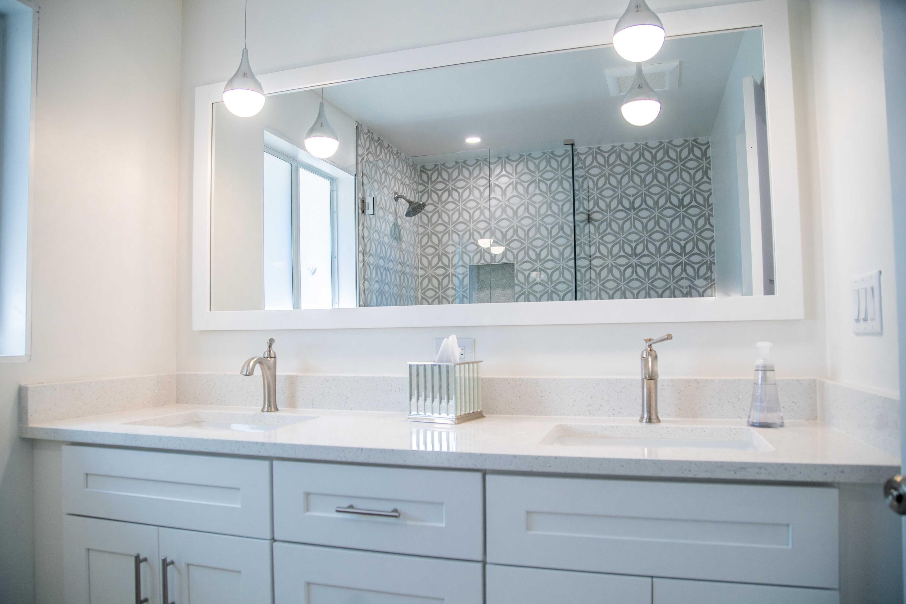 22 Van Road Jupiter, FL 33469 - Photo 18 of 38 a bathroom with a sink double vanity and a mirror