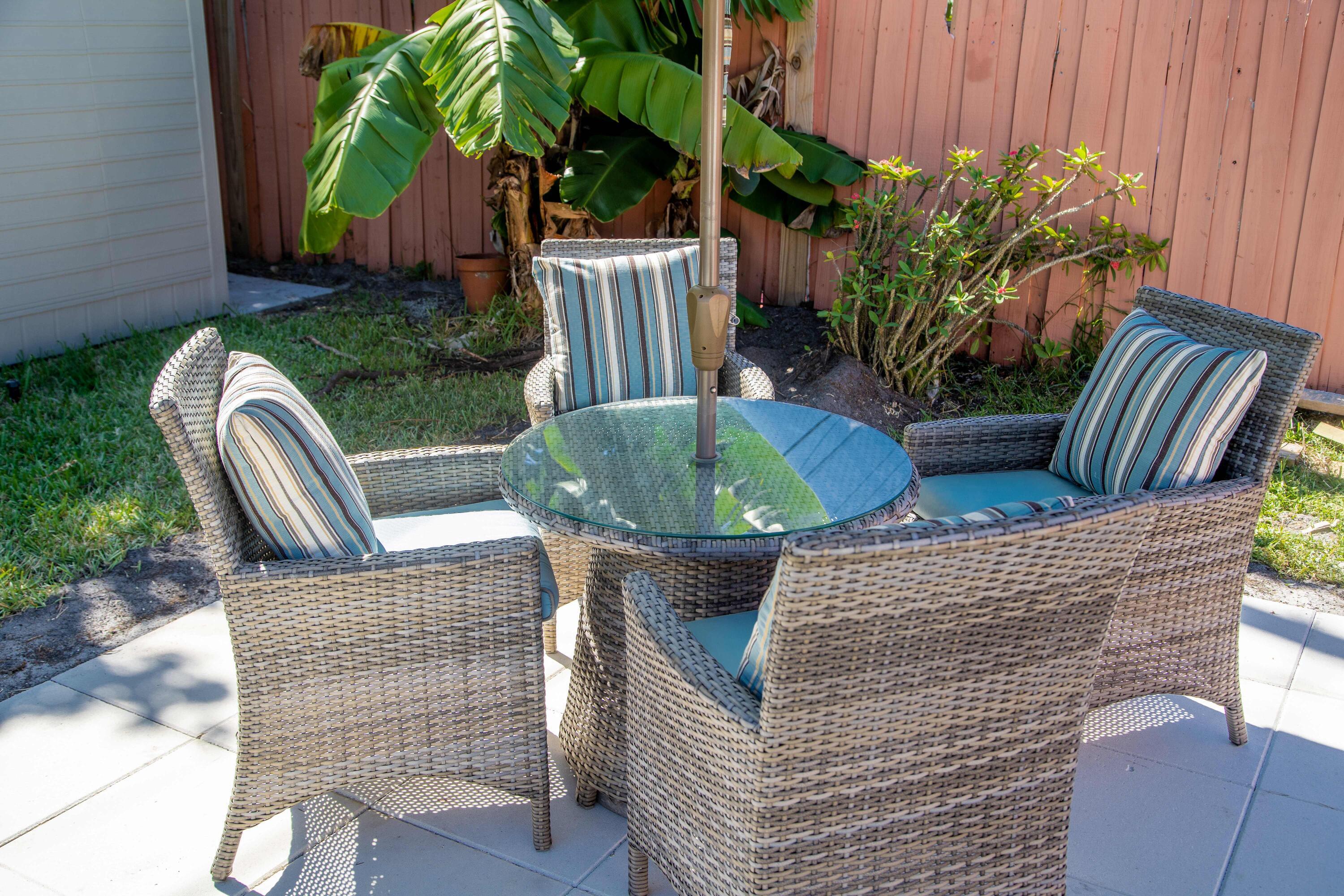 22 Van Road Jupiter, FL 33469 - Photo 28 of 38 a view of outdoor sitting area with furniture and wooden fence