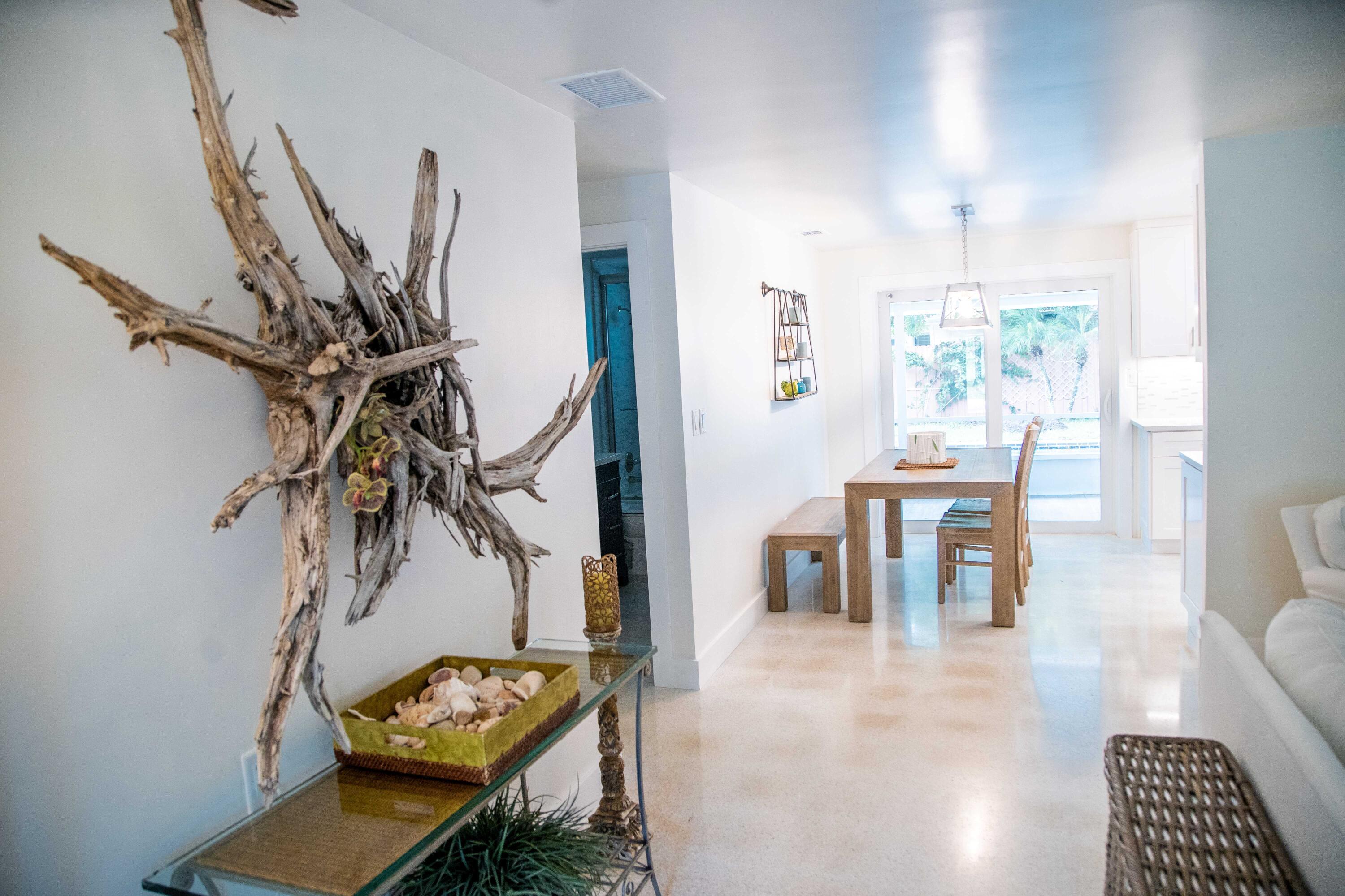 22 Van Road Jupiter, FL 33469 - Photo 34 of 38 a view of a dining room with furniture and a potted plant