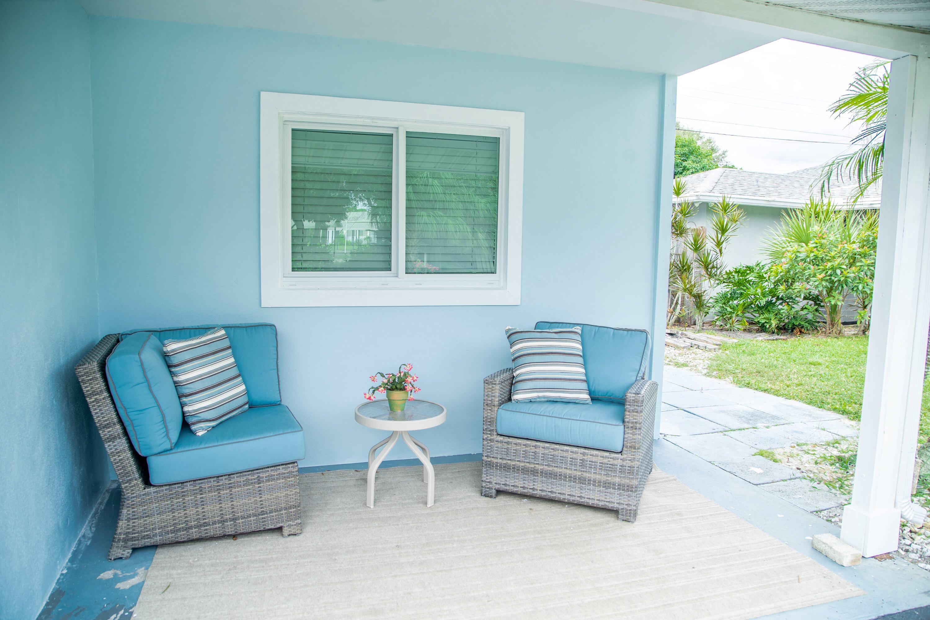 22 Van Road Jupiter, FL 33469 - Photo 35 of 38 a outdoor living space with furniture and a potted plant