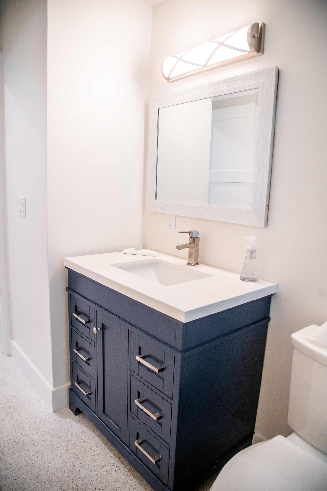 22 Van Road Jupiter, FL 33469 - Photo 9 of 38 a bathroom with a sink and a toilet