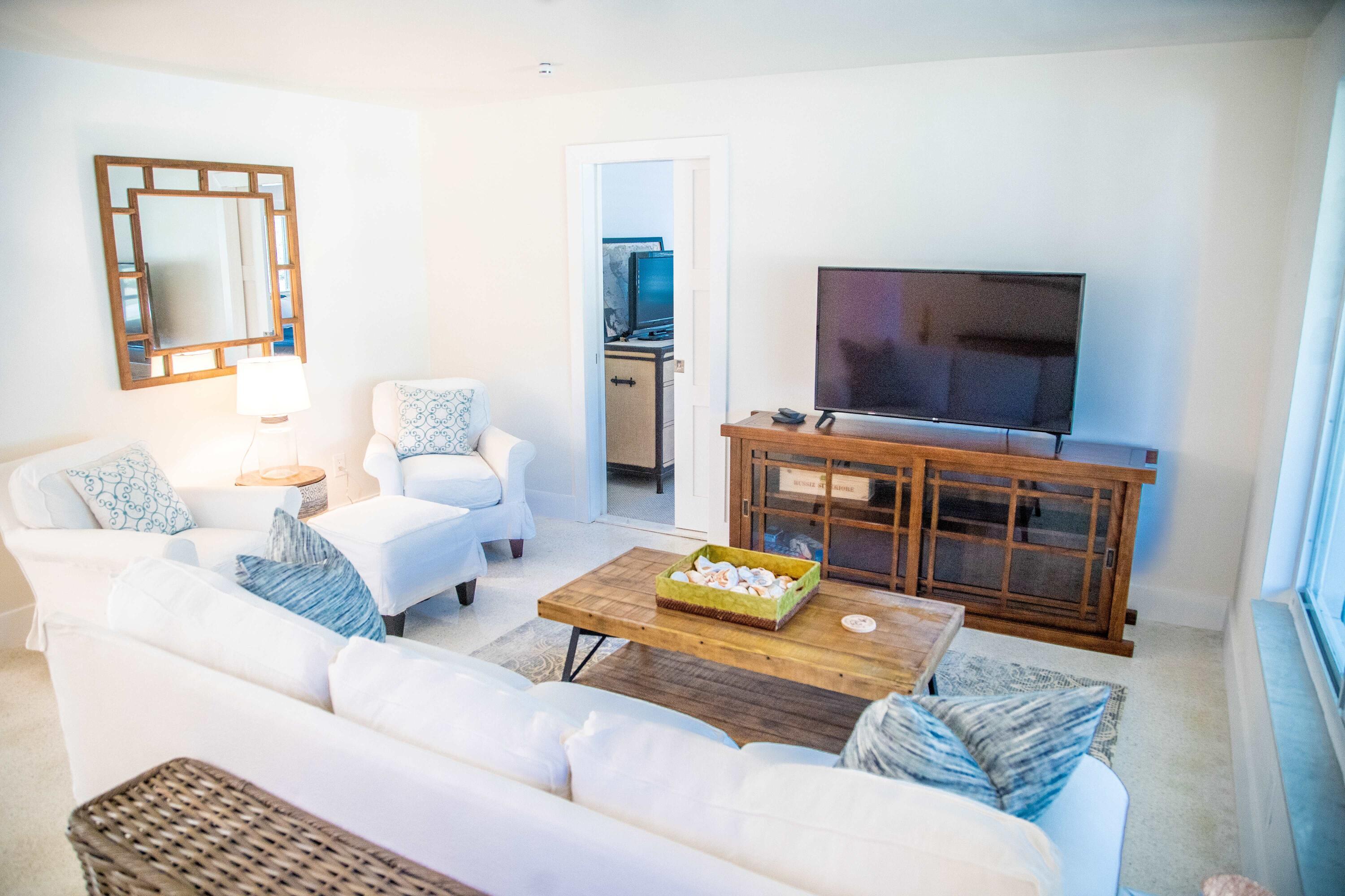 22 Van Road Jupiter, FL 33469 - Photo 10 of 38 a living room with furniture and a flat screen tv