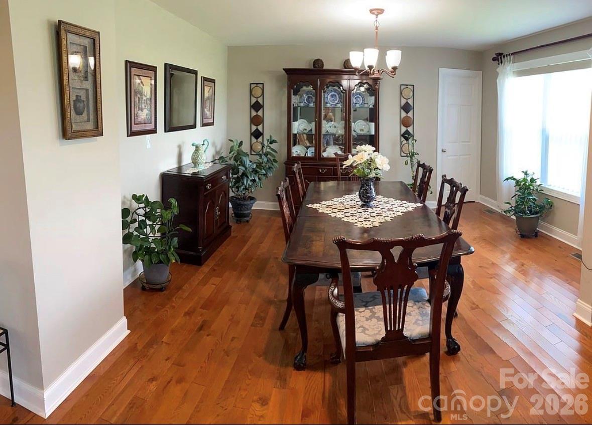 6042 Heavner Road Vale, NC 28168 - Photo 25 of 27 a view of a dining room with furniture and wooden floor