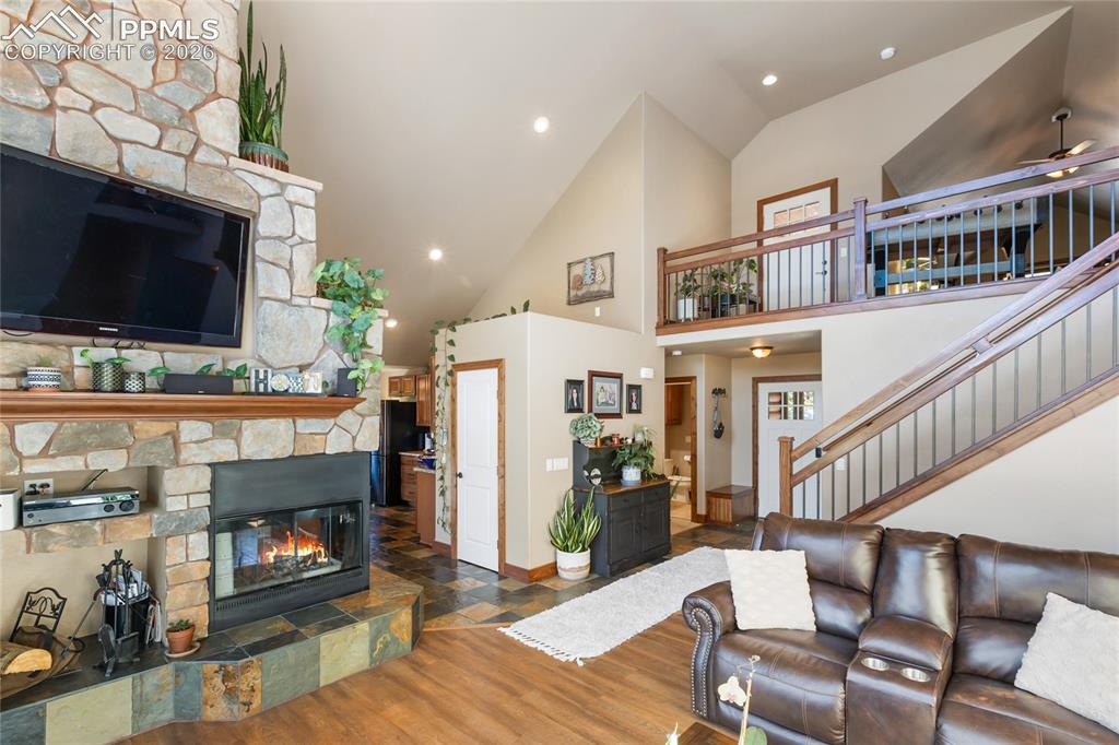 80 Feldspar Road Florissant, CO 80816 - Photo 6 of 31 This beautiful river rock 3 sided fireplace makes this home feel so warm and welcoming!