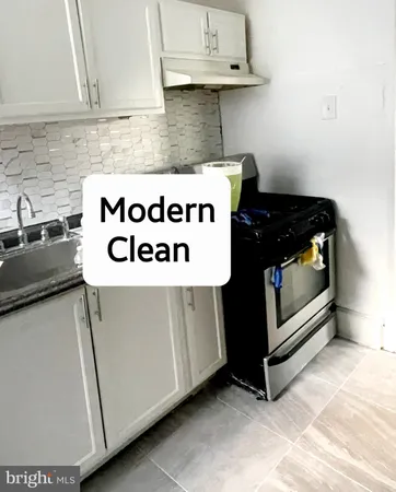 a kitchen with a stove and a microwave