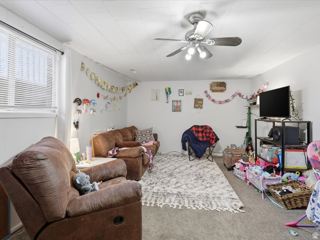 322 East 900 North Logan, UT 84321 - Photo 20 of 43 Carpeted living area with ceiling fan