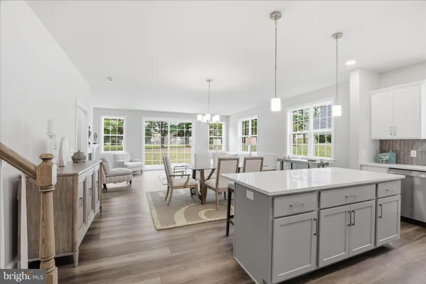 a kitchen with a sink a stove a refrigerator and cabinets