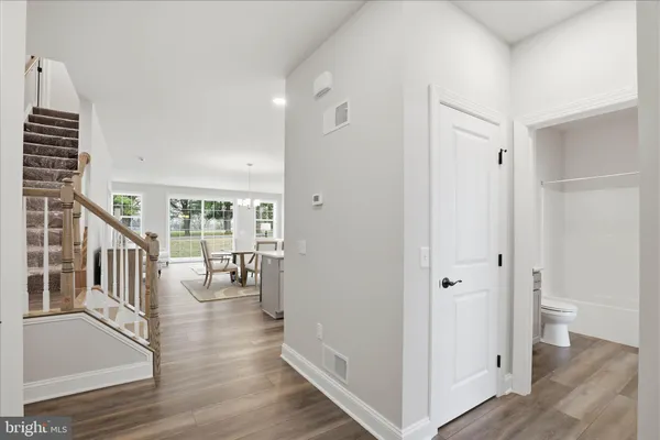 a view of an entryway with wooden floor and windows