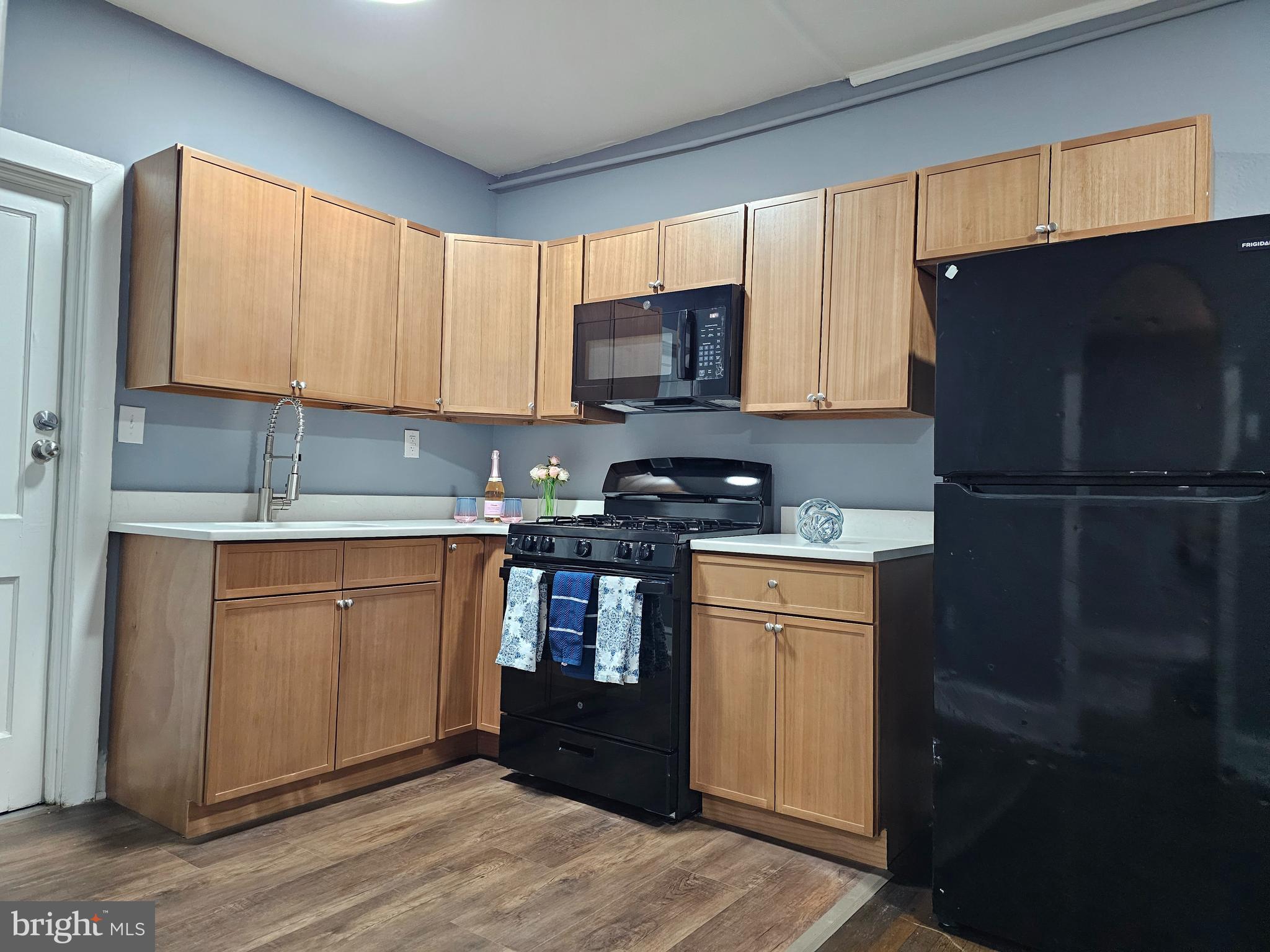 1812 North 52nd Street, Unit 1 Philadelphia, PA 19131 - Photo 4 of 9 a kitchen with a refrigerator stove and sink