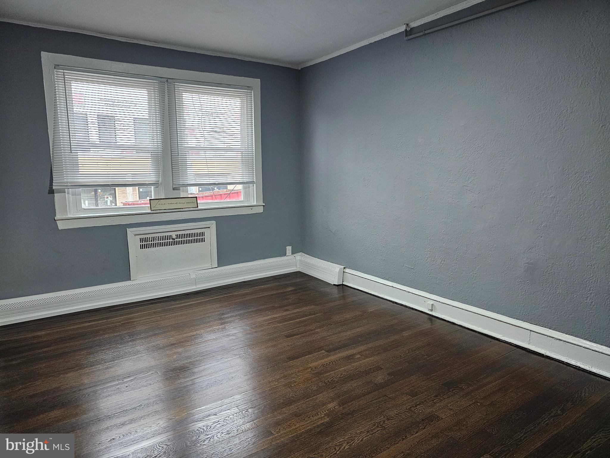 1812 North 52nd Street, Unit 1 Philadelphia, PA 19131 - Photo 6 of 9 a view of empty room with wooden floor and fan