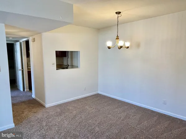 a view interior of a house with an empty space and a window