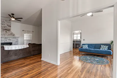 a bedroom with two bed and a flat screen tv