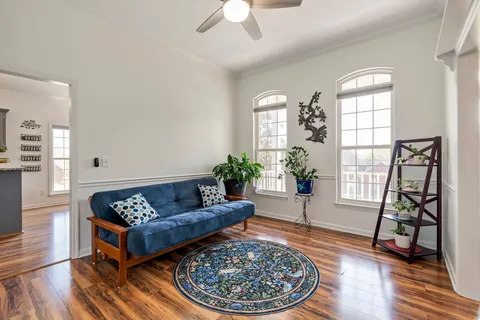 a view of an empty room with a ceiling fan